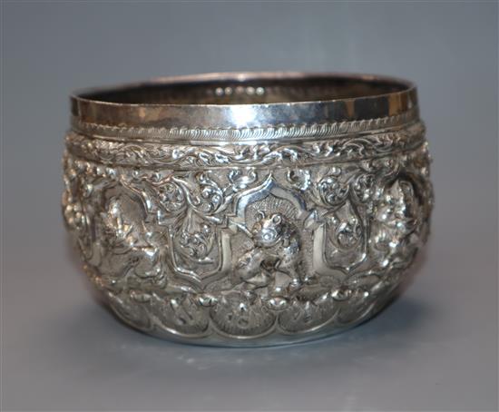 A late 19th/early 20th century Burmese white metal small bowl embossed with animals, 7.5 oz.